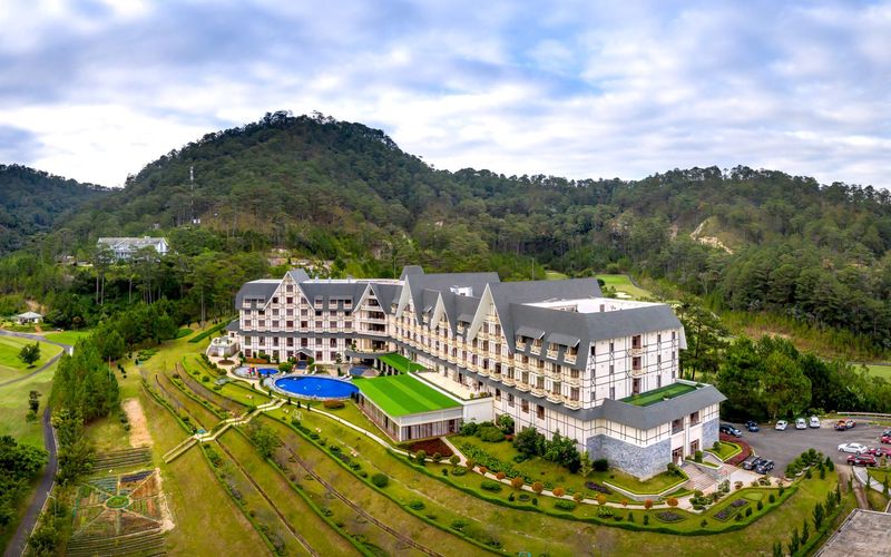 Luxury resort hotel and golf course at sunset